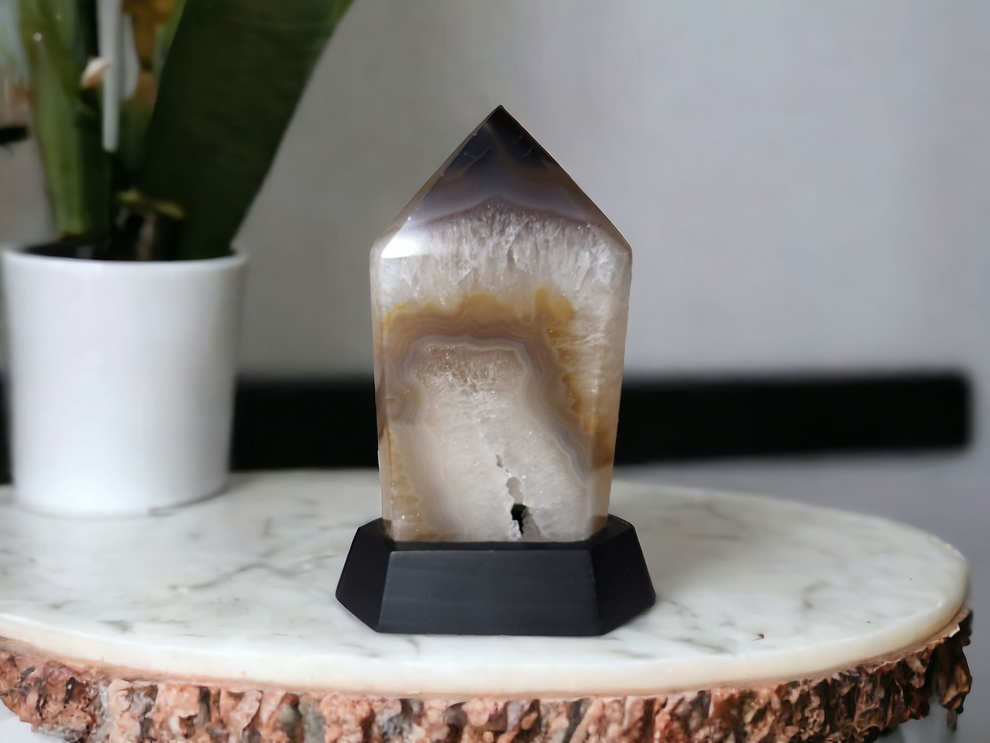 Agate Point on Stand for protection & strength – Sun Moon and Rising