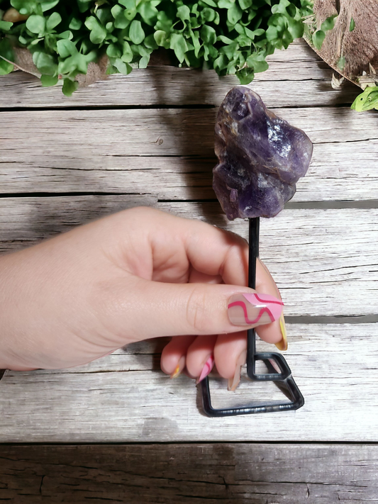 Amethyst raw specimen on a metal stand for healing