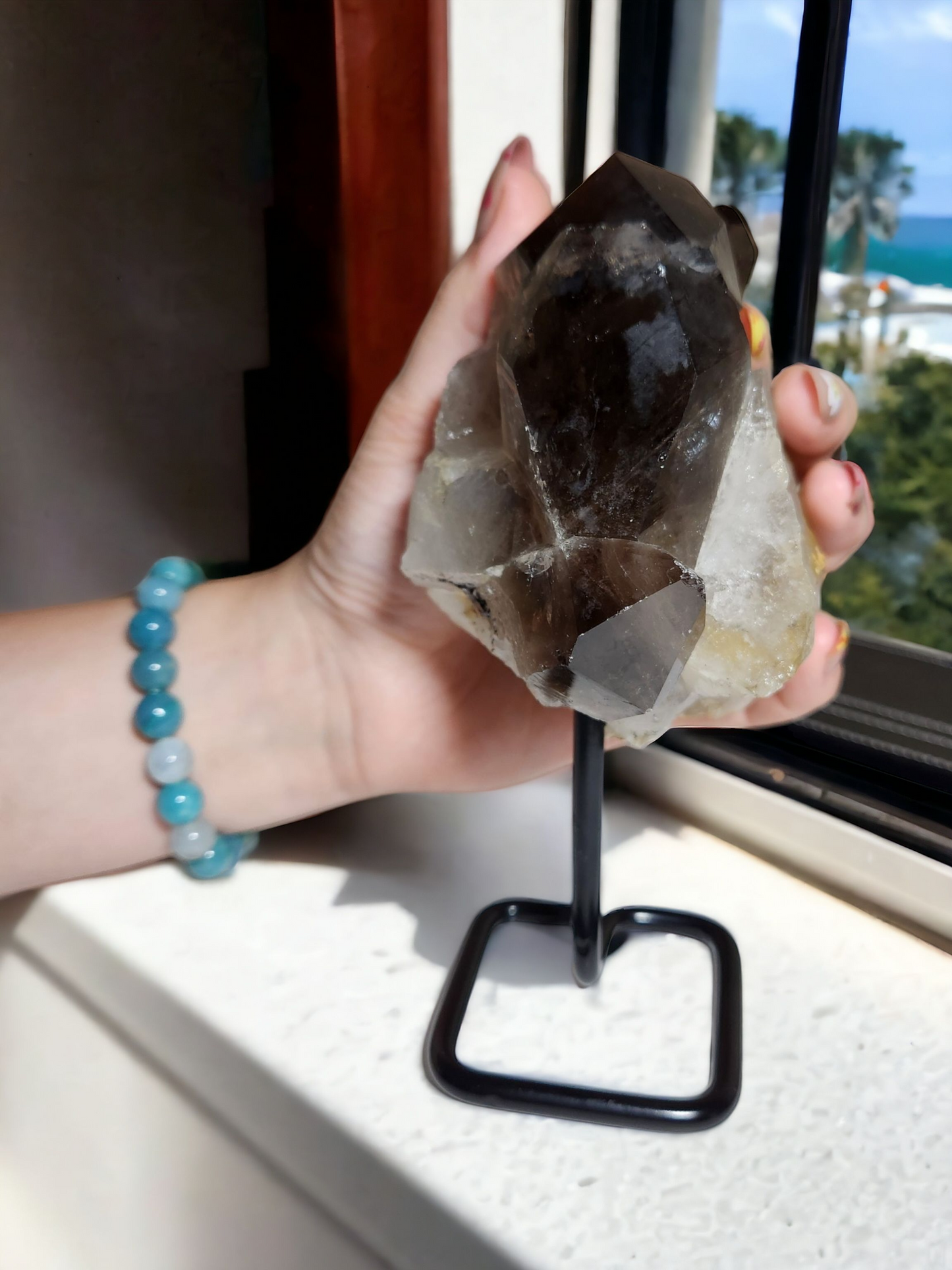 Smokey Quartz on a Metal Stand for protection